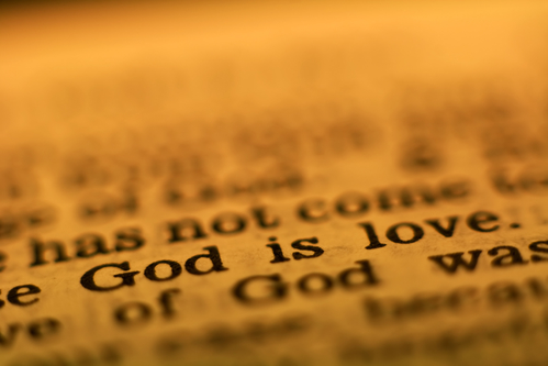Страница из Библии - "God is love" - "Бог есть любовь"